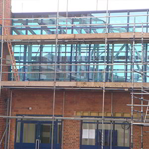 Curtain walling being added in a school by V&R